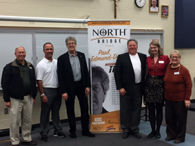 The team at Quinlan & Fabish pose with Paul after 2 great events!